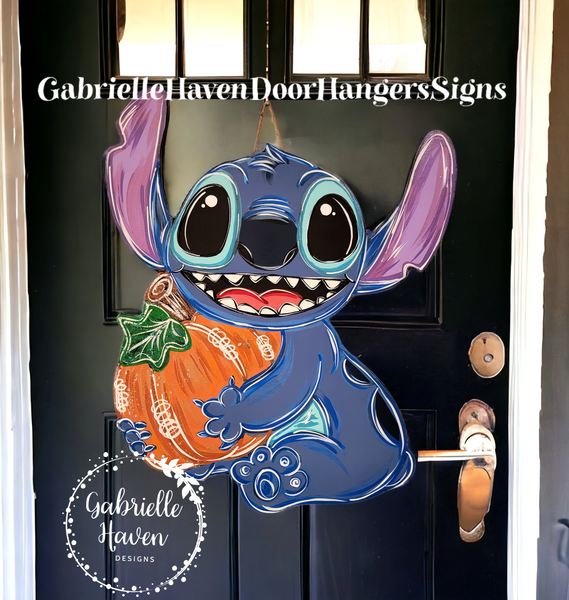 Stitch holding Pumpkin